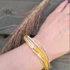 Keltainen Boho-rannekoru hopeisilla yksityiskohdilla | Monirivinen luontokoru